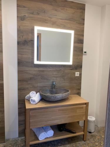 a bathroom with a sink and a mirror at Stadtvilla mit Pool in Jestetten