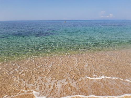 a view of a beach with the water at Nicopolis Villa in Vráchos