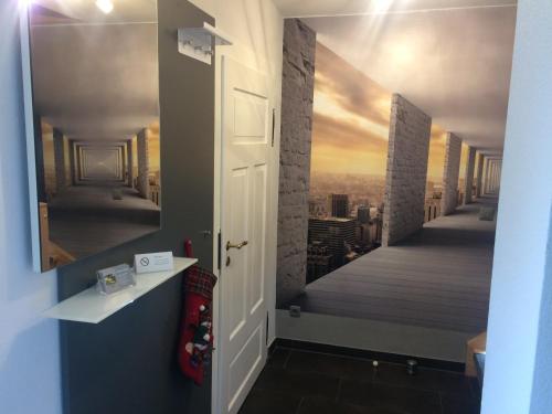 a hallway with a painting on the wall at Ferienhaus Sandy in Bad Elster