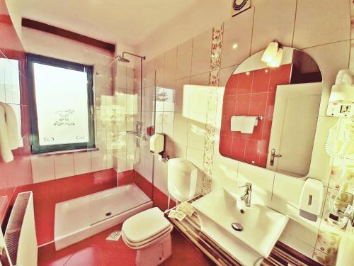 a bathroom with a sink and a toilet and a mirror at Rooms Vodisek - Depandansa Hotela Capris Capodistria Boutique in Koper