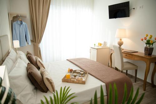 Postel nebo postele na pokoji v ubytování Porta Aragonese Luxury Rooms