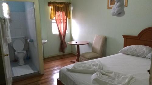 A bed or beds in a room at Ms. Holder's Comfort Villa