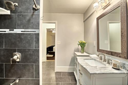 a bathroom with a sink and a mirror at Relaxing, Comfortable, Private Bedroom in Atlanta