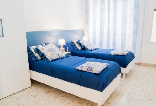 Кровать или кровати в номере Antica Akragante Apartment Agrigento con parcheggio