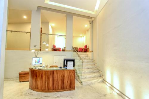 an office with a desk and stairs in a room at Hotel Real Guanajuato in Guanajuato