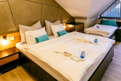 A bed or beds in a room at Apartmán Dagmar