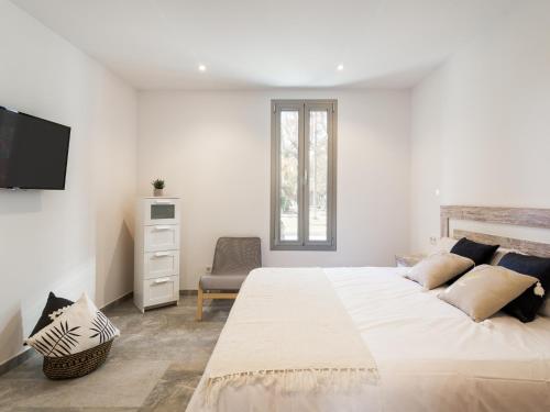 Un pat sau paturi într-o cameră la Villa margalida
