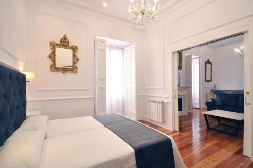 Postel nebo postele na pokoji v ubytování Rua Suites Boutique