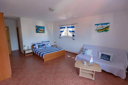 Postel nebo postele na pokoji v ubytování Apartments Elena