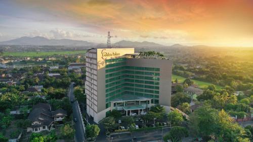 
a large building with a view of a city at Golden Palace Hotel Lombok in Mataram

