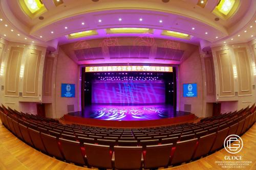 an auditorium of a theatre with purple lighting at GUOCE Beijing Capital Airport Hotel & Convention Center in Shunyi