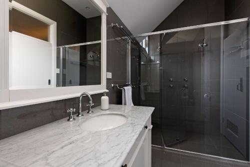 a bathroom with a sink and a shower at Pirralilla Estate Adelaide Hills in Aldgate
