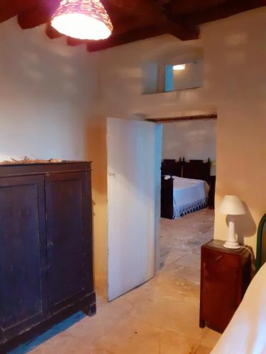 a room with a bedroom with a bed at Posta Santa Croce in Bisceglie