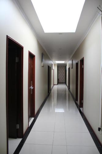 an empty corridor in a building with a ceiling at City Lodge in Port Vila