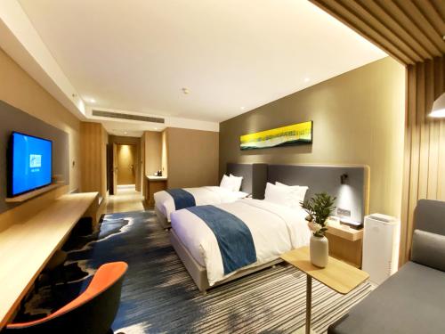 Μια τηλεόραση ή/και κέντρο ψυχαγωγίας στο Holiday Inn Express Liaocheng Chiping by IHG