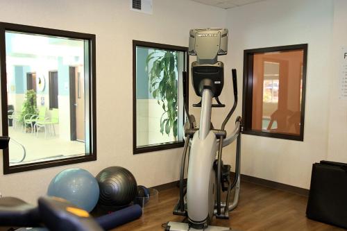 a room with a hair dryer and exercise equipment at Holiday Inn Express Hotel & Suites Ashland by IHG in Ashland