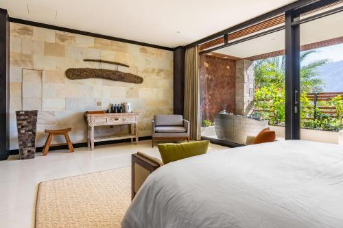 a bedroom with a large bed and a bathroom at The Bale Villas牛眠埔里 in Puli