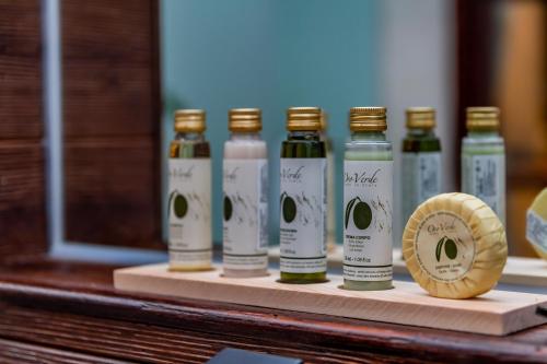a row of bottles of olive oil sitting on a counter at The Bale Villas牛眠埔里 in Puli