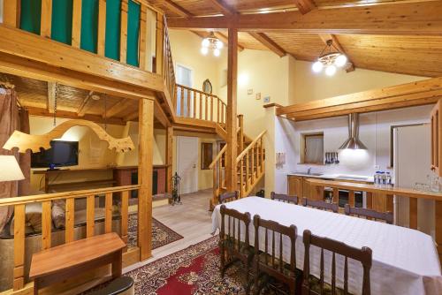a large room with a bed and a staircase at Recreational resort Zavidovo in Zavidovo
