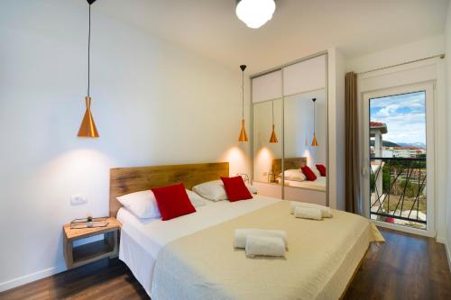 Ένα ή περισσότερα κρεβάτια σε δωμάτιο στο Apartments Bulli