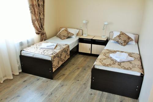 Cama o camas de una habitación en Guest House on Ostrovskogo