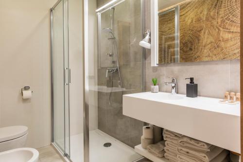 a bathroom with a sink and a shower at Royal Hill Residence in Zakopane