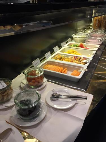 a buffet line with many different types of food at Hotel Glockenhof Zürich in Zürich