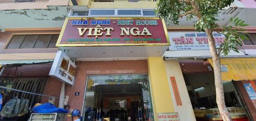 a store with a sign that reads vet naya at NHÀ NGHỈ VIỆT NGA in Ha Tien