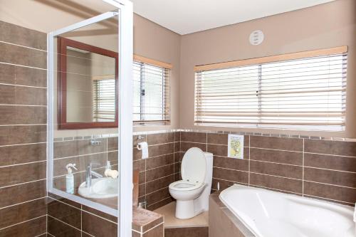 Ett badrum på 80 Kendal Guest House
