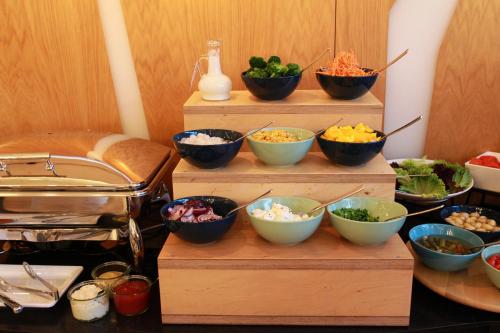a group of bowls of food sitting on a table at Invite in Wrocław