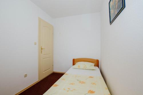 Ένα ή περισσότερα κρεβάτια σε δωμάτιο στο Apartmani Vrlika