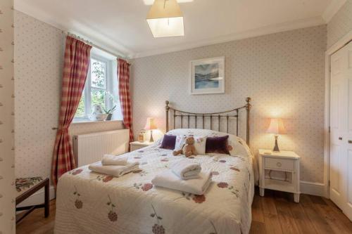 Katil atau katil-katil dalam bilik di Gardeners Cottage