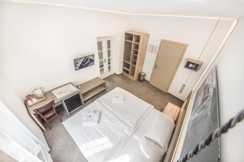 an overhead view of a living room with a white table at OH Apartments & Rooms in Ljubljana