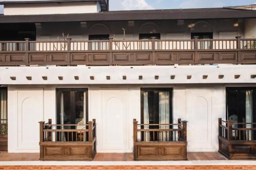 a white building with wooden balconies on it at Hotel Roadhouse, Thamel, Kathmandu- Contemporary Boutique in Kathmandu