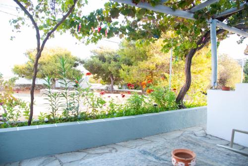 a patio with a view of a garden at Themonia in Apollonia
