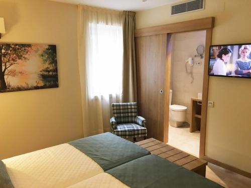 
Een bed of bedden in een kamer bij Hotel & Spa Real Villa Anayet
