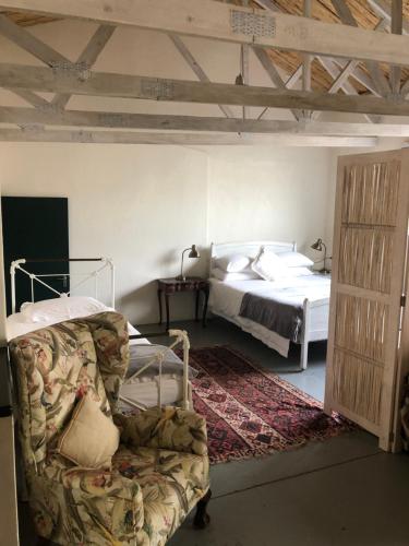 Ένα ή περισσότερα κρεβάτια σε δωμάτιο στο Kookfontein Farm Cottages