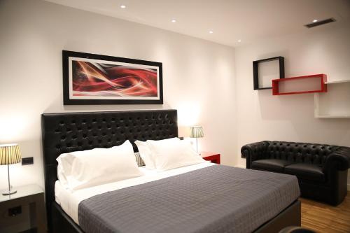 Un pat sau paturi într-o cameră la Fonte Del Benessere Resort