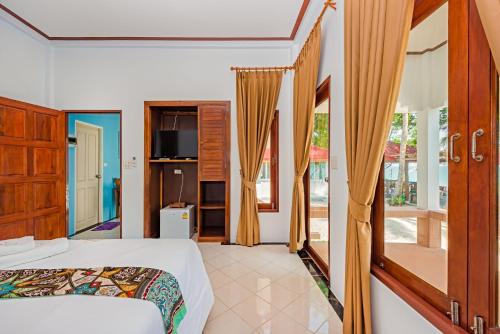 Кровать или кровати в номере The Boutique Khanom