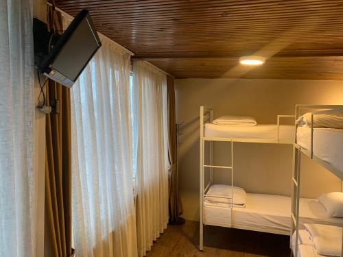 Cama o camas de una habitación en Antique Hostel