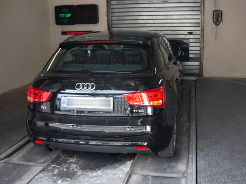 a black car is parked in a garage at EA ApartHotel Melantrich in Prague