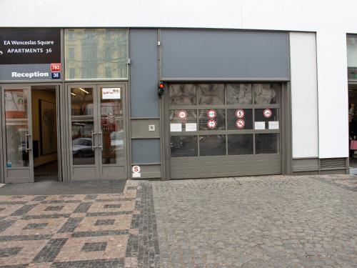 a store front with doors and signs on it at EA ApartHotel Melantrich in Prague