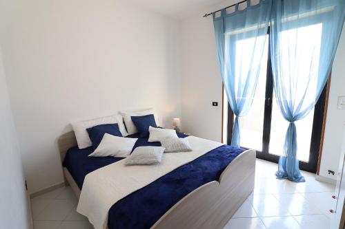 A bed or beds in a room at Giò Otranto holiday home for 6 people