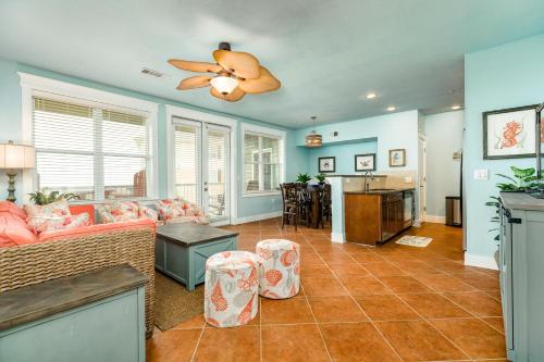 a living room with a couch and a ceiling fan at Sandpiper Point in Galveston