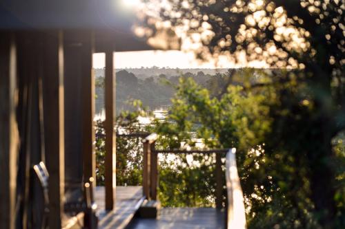 a balcony with a view of a city at Simbavati Hilltop Lodge in Timbavati Game Reserve