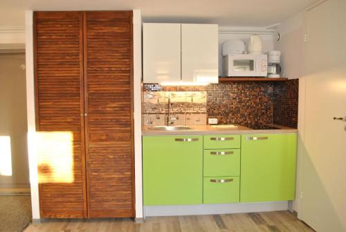 Η κουζίνα ή μικρή κουζίνα στο Aasa Apartments