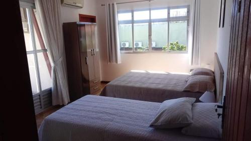 Ένα ή περισσότερα κρεβάτια σε δωμάτιο στο POUSADA LOS AMIGOS CAMPECHE