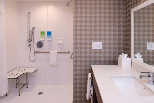 a bathroom with a shower and a sink and a toilet at Home2 Suites By Hilton Columbus/West, OH in Columbus