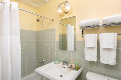 a bathroom with a sink and a mirror at The Pierpont Inn in Ventura