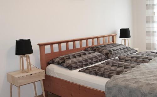 Postel nebo postele na pokoji v ubytování Szabadság Apartman Pécs